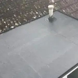 a cup of coffee sitting on top of a roof